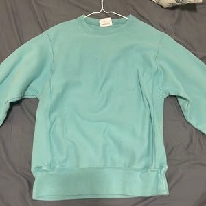 Baby Blue champion sweater. Good condition and no stains or holes. (Mens small)